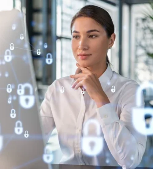attractive-businesswoman-white-shirt-workplace-working-with-laptop-defend-customer-cyber-security-concept-clients-information-protection-padlock-hologram-office-background-scaled-1
